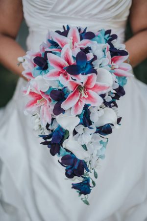 Tiger lily and galaxy orchid bouquet with turquoise accent