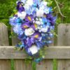 Cascading Iris and orchid bouquet with baby's breath