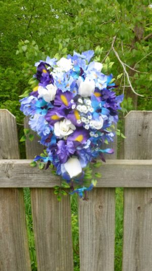 Cascading Iris and orchid bouquet with baby's breath
