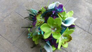 Green orchid, teal picasso calla and galaxy orchid bridal bouquet with peacock - Image 5