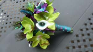 Green orchid, teal picasso calla and galaxy orchid bridal bouquet with peacock - Image 3