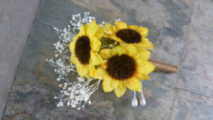 Sunflower boutonniere, button hole with baby's breath