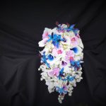 Cascading blue calla and orchid bouquet with lavender accent