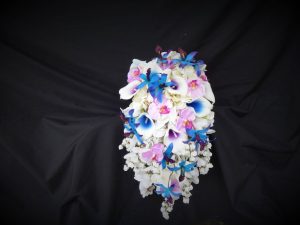 Cascading blue calla and orchid bouquet with lavender accent