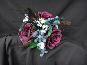 Plum rose bouquet with blueberries and baby's breath