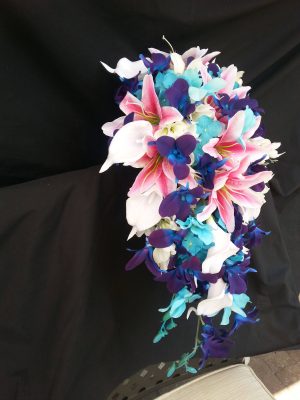 Tiger lily and galaxy orchid bouquet with turquoise accent - Image 6