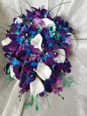 Galaxy orchid and calla lily bouquet with turquoise accent