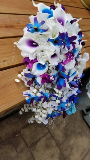 Cascading white hydrangea bouquet with blue orchids - Image 5