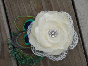 Bridal ivory satin lace flower hair clip accented with a rhinestone, peacock eye and sward feathers - Image 2