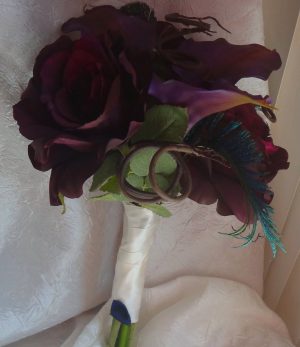 Purple bridal bouquet, toss bouquet, bridesmaid's bouquet with peacock accent