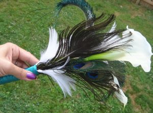 Simple calla lily bridesmaid bouquet with white and peacock feather accent - Image 3
