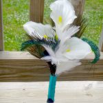 Simple calla lily bridesmaid bouquet with white and peacock feather accent