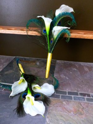 Simple calla lily bridesmaid bouquet with peacock feathers - Image 5