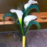 Simple calla lily bridesmaid bouquet with peacock feathers