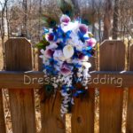 Cascading Purple blue dendrobium orchid bouquet peacock feathers