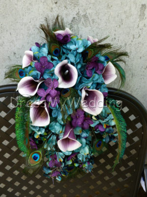 Teal and plum cascading bouquet with peacock feathers