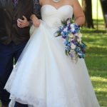 Champagne cascading bridal bouquet with blue orchids