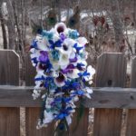 Cascading bridal bouquet with blue orchids