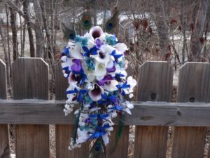 Cascading bridal bouquet with blue orchids
