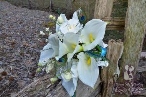 White calla lily, peacock, orchid bridal bouquet