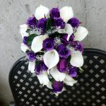 Purple rose white calla lily bridal bouquet with baby's beath