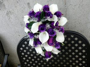 Purple rose white calla lily bridal bouquet with baby's beath