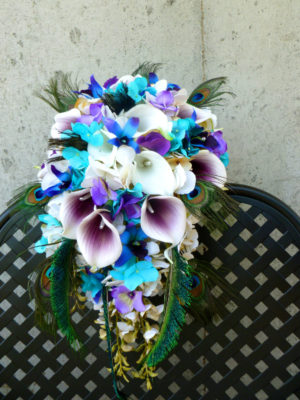 Cascading bridal bouquet with peacock feathers
