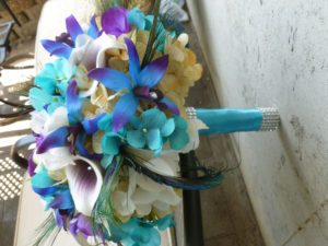 Cascading bridal bouquet with peacock feathers - Image 4