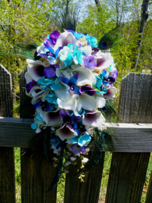 Cascading bridal bouquet with peacock feathers - Image 5