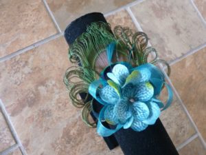 Peacock pearl wrist corsage with teal accent, customizable