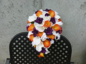 Orange and plum cascading bridal bouquet