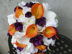 Orange and plum cascading bridal bouquet - Image 4