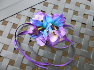 Purple and blue wrist corsage made with purple hydrangeas, galaxy orchids, purple ribbon ties, royal blue, royal purple - Image 3