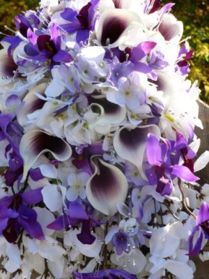 Cascading bridal bouquet with purple, plum, lavender