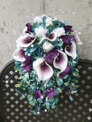 Teal plum cascading bouquet with picasso calla lilies, blue, purple hydrangea bouquet, teardrop bouquet, peacok feathers, pearls
