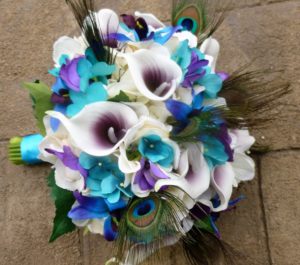 Ivory, turquoise and plum bouquet with peacock feathers