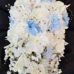 Cascading bouquet with white and blue hydrangea accent