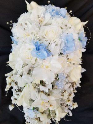 Cascading bouquet with white and blue hydrangea accent