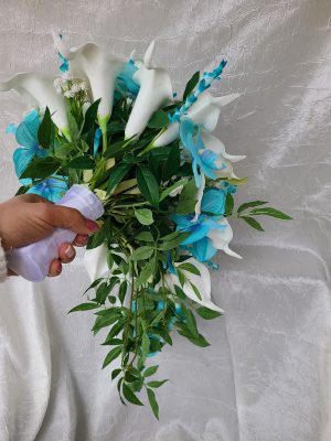 Cascading turquoise orchid, calla and plumeria beach wedding bouquet - Image 9