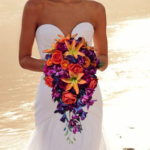 Cascading Bridal Bouquet Silk Flower Arrangement Jewel Tone Collection Orange Purple Orchid Design Artificial Rose Bouquet Teardrop Shape Elegant Wedding Accessory Tropical Destination Ceremony Fall Wedding Option Vibrant Color Palette